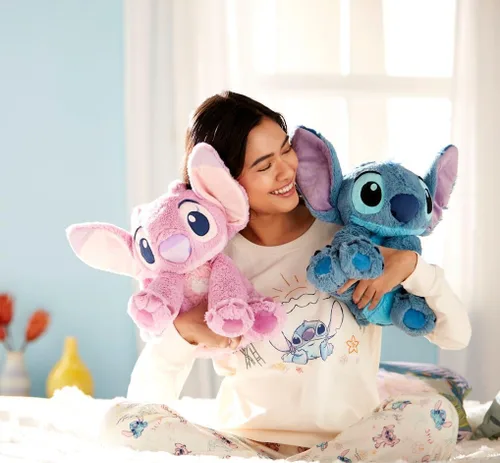 Vista 4 de Disney Store Juguete oficial de ángel mediano suave para niños, personaje de peluche con textura mullida y detalles bordados, orejas flexibles