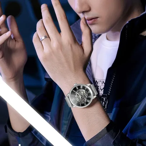 Vista 3 de Gosasa Reloj automático único para hombre, esfera transparente, esqueleto hueco, tono plateado, correa de malla, Oro Rosa