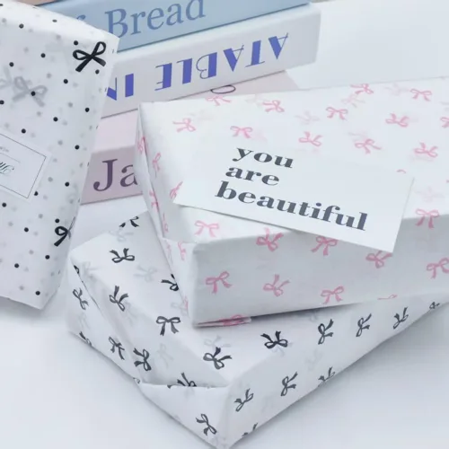Vista 2 de Papel de seda a granel con patrón de lazo rosa, 25 hojas de 19.7 x 27.5 pulgadas para bolsas de regalo de cumpleaños, boda, manualidades, envoltura