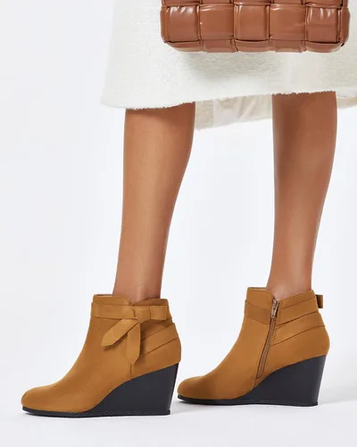 Vista 4 de Botines de mujer con nudo cerrado y cremallera lateral, tacón apilado, botines de cuña