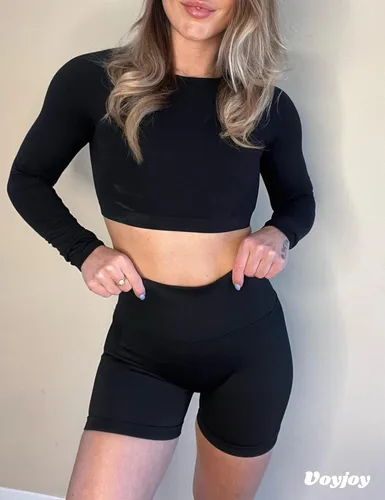 Vista 5 de VOYJOY Pantalones cortos de entrenamiento para mujer de 3.6 pulgadas, con levantamiento de glúteos, pantalones cortos de gimnasio sin costuras