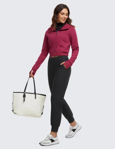 Vista 4 de CRZ YOGA Pantalones deportivos de entrenamiento con forro polar para mujer con bolsillos de 27.5 pulgadas, pantalones de senderismo y correr al aire