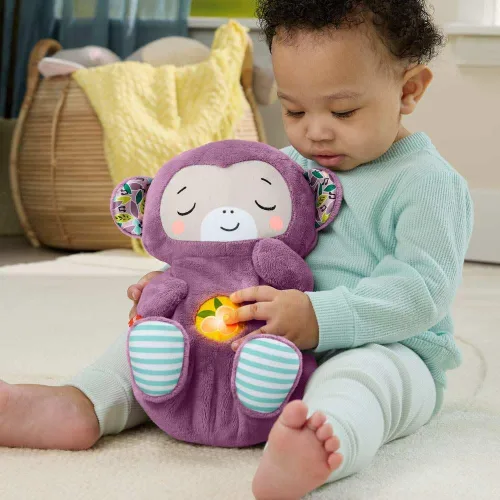 Vista 8 de Fisher-Price Juguetes para bebés Soothe ‘n Snuggle Mono púrpura de peluche máquina de sonido portátil con movimiento de respiración y luces