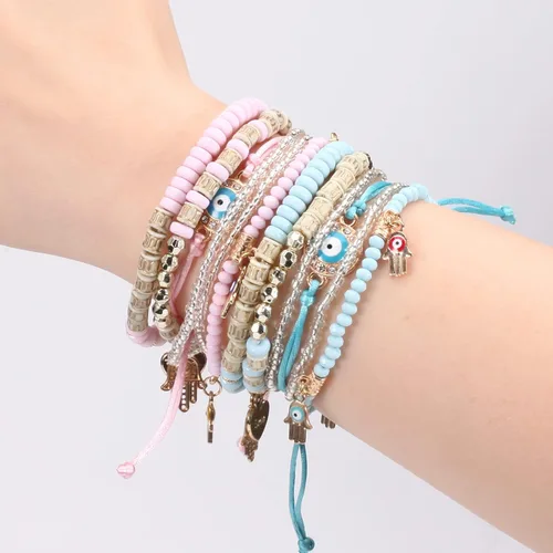 Vista 6 de Budsmile Pulseras bohemias de cuentas elásticas para mujeres y niñas, juego de pulseras apilables en múltiples capas, dijes multicolor hechos a