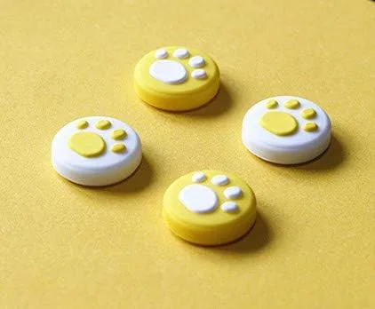 Vista 2 de Tapas de silicona para el pulgar con diseño ergonómico para Nintendo Switch NS Joy ConSwitch Lite Controller Cat Paw Amarillo