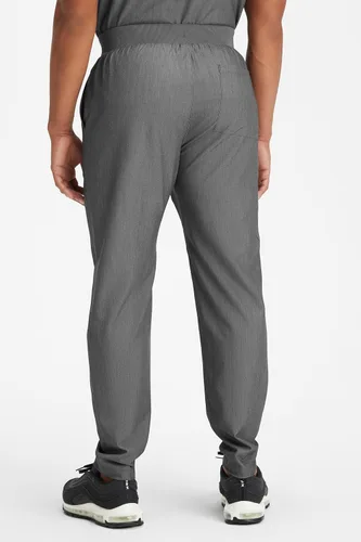 Vista 2 de Fabletics MotionTech - Pantalón médico para hombre, elástico en 4 direcciones, con bolsillos, resistente a las arrugas, ajuste semidelgado