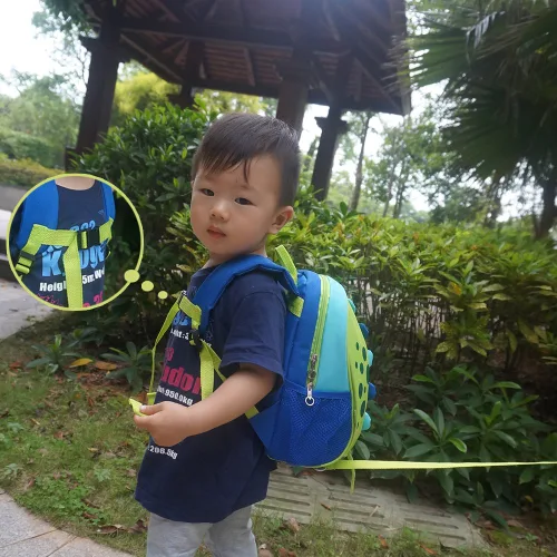 Vista 3 de Yodo, Bolsa para almuerzo aislada y mochila preescolar infantil, con correa de arnés de seguridad para niños o niñas, Dinosaur