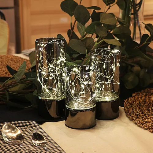 Vista 4 de Rhytsing conjunto de 3 linternas de cilindro de vidrio con luces de hadas, lámpara de mesa decorativa con batería, vela sin llama con función