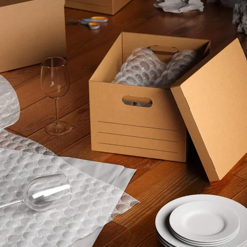 Vista 8 de Amazon Basics Cajas de mudanza con asas y tapas, 15x10x12 pulgadas, Marrón, Paquete de 20