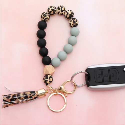 Vista 3 de BAOSIWA - Llavero de silicona con cuentas de leopardo, llavero para mujer, con borla de cuero