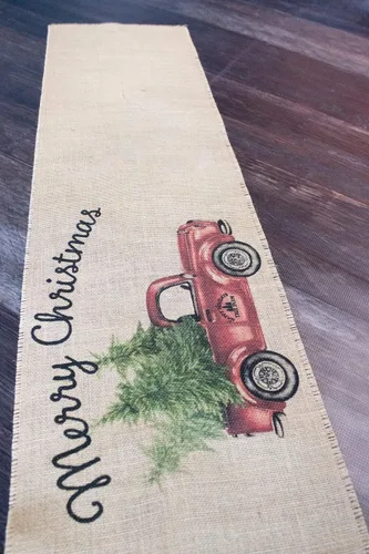Vista 3 de Camino de mesa vintage de arpillera con diseño de camión rojo feliz Navidad
