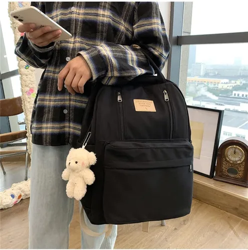 Vista 2 de AONUOWE Mochila preppy con peluches linda mochila para adolescentes y niñas, bolsas escolares ligeras de academia, bolsa escolar de estética sólida