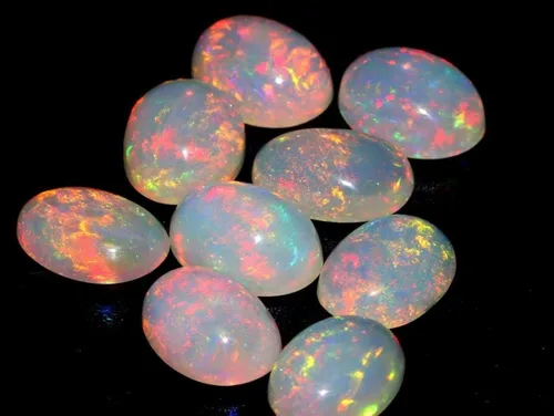 Vista 4 de Cabujón de piedras preciosas sueltas de ópalo blanco etíope ultra fuego ovalado Welo natural de ópalo de fuego (1 unidad) piedra natal curativa