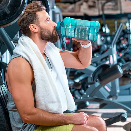 Vista 7 de NatureWorks HydroMATE Botella de agua de medio galón con horarios para beber sin BPA, a prueba de fugas, jarra reutilizable con asa, 64 onzas