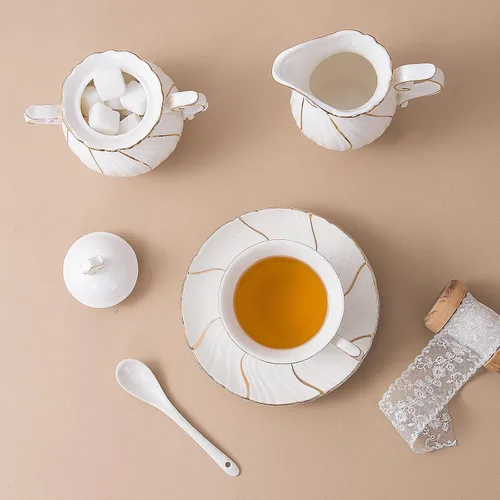Vista 8 de Agyiuns Juego de té de 21 piezas de tazas de té y platillos de cerámica, juego de 6 con azúcar y crema y tetera, juego de tetera para adultos