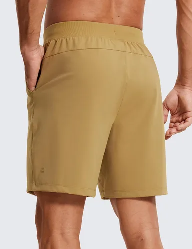 Vista 3 de CRZ YOGA Pantalones cortos de entrenamiento elásticos en cuatro direcciones para hombre, 7 pulgadas, suaves, duraderos, casuales, con bolsillos