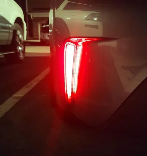 Vista 4 de iJDMTOY Luces reflectoras de parachoques LED de lente roja compatibles con Toyota Corolla Sedán 2019-22, funciona como faros antiniebla traseros