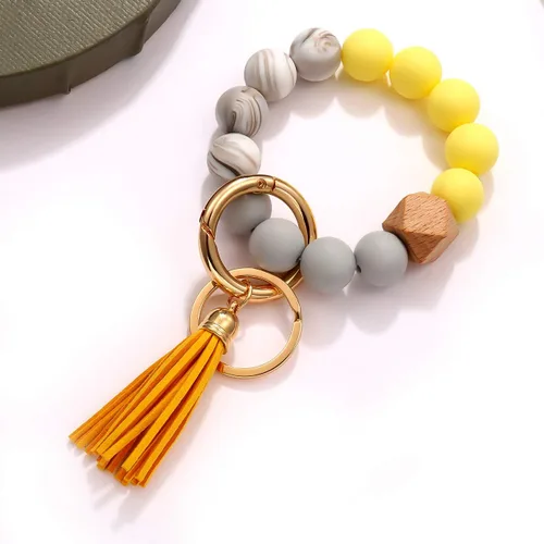 Vista 4 de boderier Pulsera de silicona llavero pulsera pulsera llavero portátil casa coche llaves anillo titular con borla