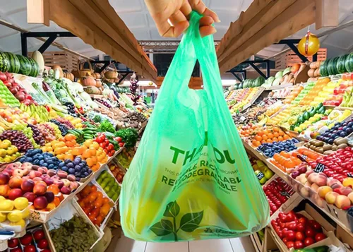 Vista 3 de Paquete de 50 bolsas de camiseta con asas de 22 x 12 pulgadas, bolsas de plástico biodegradable verde para compras, bolsas de agradecimiento