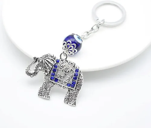 Vista 2 de Amosfun Llavero de elefante vintage con colgante de ojos azules de pavo y mal de ojo, llavero de buena suerte, azul para fijar a llaves