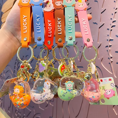 Vista 4 de Linda mochila flotante de ovejas colgante de llave de coche para niños niñas mujeres acrílico Choud bolso cartera llavero líquido