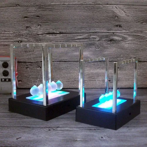 Vista 4 de LIZEALUCKY Luminiscencia LED Newtons Cuna Balance Bola de péndulo Bolas Coloridas Equilibradas Bolas de Juguete Ciencia Péndulo Decoración de Mesa