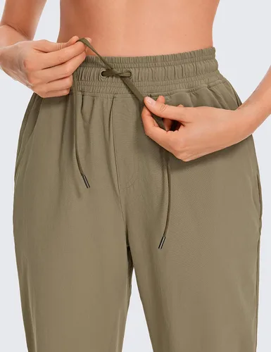 Vista 6 de CRZ YOGA Pantalones deportivos para mujer, impermeables, para exteriores, golf, atléticos, ligeros, con bolsillos con cremallera, de 27 pulgadas