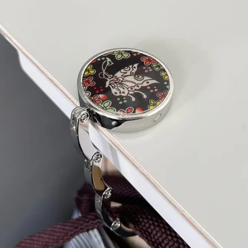 Vista 4 de Wrapables Percha escénica con gancho para bolso, colgador de mesa plegable para bolso, mariposa Deco