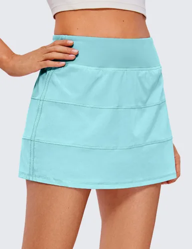 Vista 2 de CRZ YOGA Faldas de tenis de cintura alta para mujer con 3 bolsillos, faldas de golf, acampanadas, ligeras, bonitas, atléticas, casuales