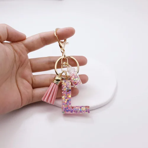 Vista 5 de Mlouye Llaveros coloridos con letras de estrella para mujeres y niñas, lindas resinas de la A a la Z, letras del alfabeto con borla para llaves