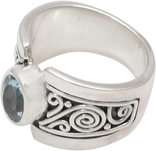 Vista 4 de NOVICA Anillo artesanal hecho a mano con topacio azul de una sola piedra de ley .925 ancho con piedra natal de serenidad de Indonesia 'Blue Karma