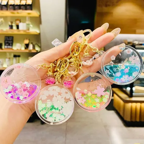 Vista 5 de Sunfans Llavero para niñas y mujeres, con diseño de flor de cerezo y flores de ensueño, diseño de arena en movimiento