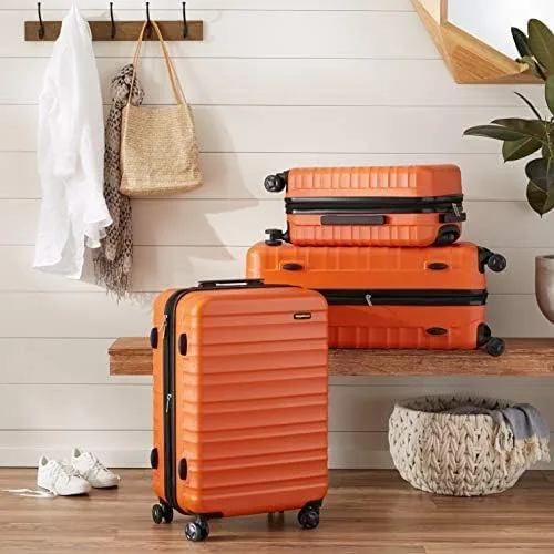 Vista 7 de Tienda Basics Maleta rígida giratoria, equipaje de mano expandible con ruedas, Naranja, Spinner