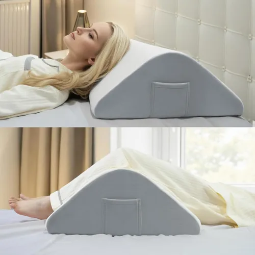 Vista 4 de Almohada de rodilla de espuma viscoelástica, funda blanca acolchada con base gris, soporte ortopédico