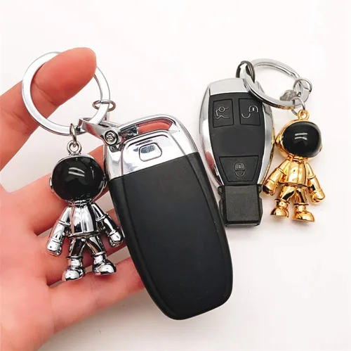 Vista 6 de Llavero de robot negro para hombre diseño creativo de hombre espacial llavero de coche para oficina mochila y bolso