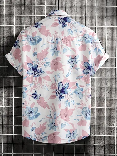 Vista 2 de OYOANGLE Camisa hawaiana de manga corta con botones y estampado tropical para hombre