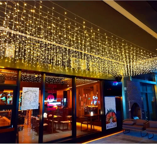 Vista 10 de Luces LED de carámbano de Navidad, 13 pies, 96 luces de hadas LED en cadena, cortina extensible, 8 modos, luces colgantes parpadeantes novedosas