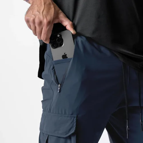 Vista 4 de Pantalones de entrenamiento ligeros para hombre con bolsillos con cremallera