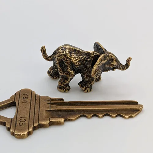 Vista 7 de Figura de elefante bebé hecha a mano, pequeña escultura de elefante coleccionable, adorno en miniatura de metal pequeño animal de la selva