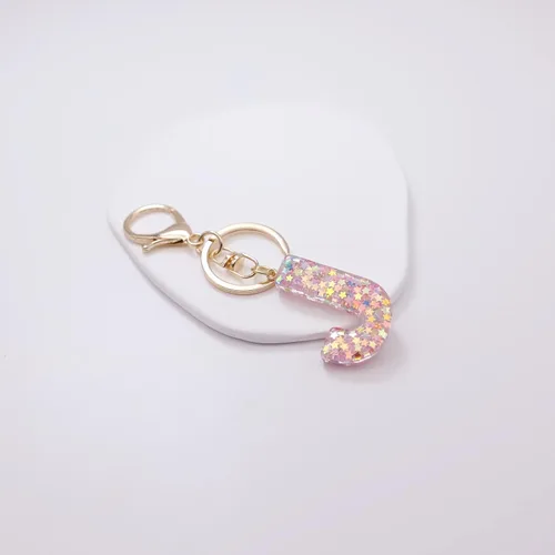 Vista 4 de Mlouye Llaveros coloridos con letras de estrella para mujeres y niñas, lindas resinas de la A a la Z, letras del alfabeto con borla para llaves