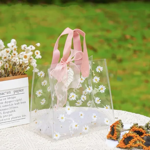 Vista 8 de YMASELA Bolsa de regalo transparente con asas (9.8 x 9.1 x 5.5 pulgadas, 2 unidades) bolsa de embalaje de regalo impermeable de plástico resistente