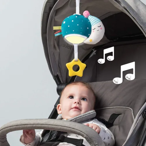 Vista 5 de Taf Toys Mini luna musical, juguete para bebés con música colgante y luces para llevar, compañero de viaje para padres y bebés, calma al bebé