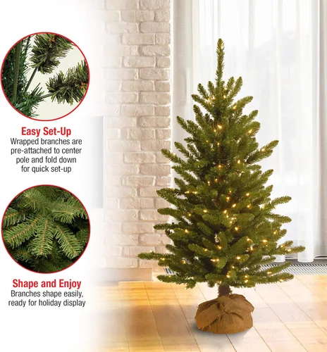 Vista 4 de National Tree Company - Mini árbol artificial de Navidad preiluminado de 4 pies Kensington, 150 luces transparentes, 284 puntas, base de arpillera