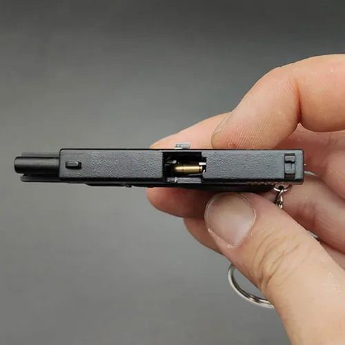 Vista 4 de Mini llavero de pistola, llavero con forma de pistola, llavero táctico pequeño con forma de pistola, regalo con colgante en forma de armas, llaveros