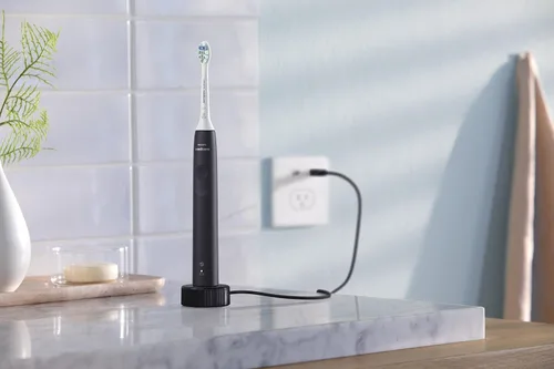 Vista 13 de Philips Sonicare 4100 Cepillo de dientes eléctrico recargable, negro, con cabezales de repuesto originales Philips Sonicare Optimal para control