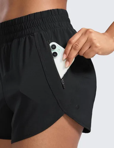 Vista 5 de CRZ YOGA Pantalones cortos para correr para mujer, talle alto, con bolsillo con cremallera, forro de malla, entrepierna de 3 pulgadas, dobladillo