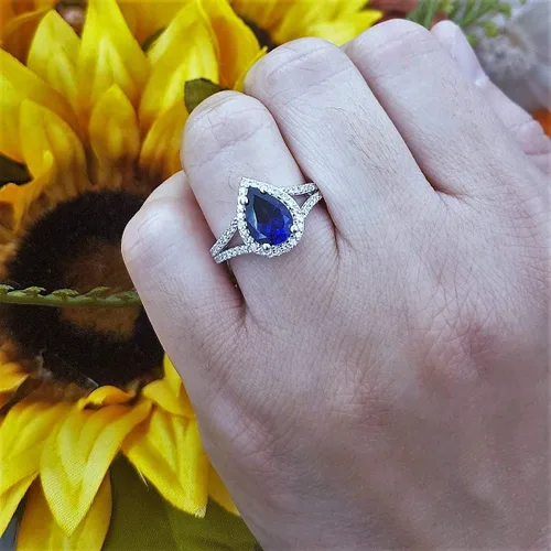Vista 38 de Dazzlingrock Collection Anillo de compromiso con forma de lágrima y diamante blanco natural redondo de 0.45 quilates con halo de diamantes blancos