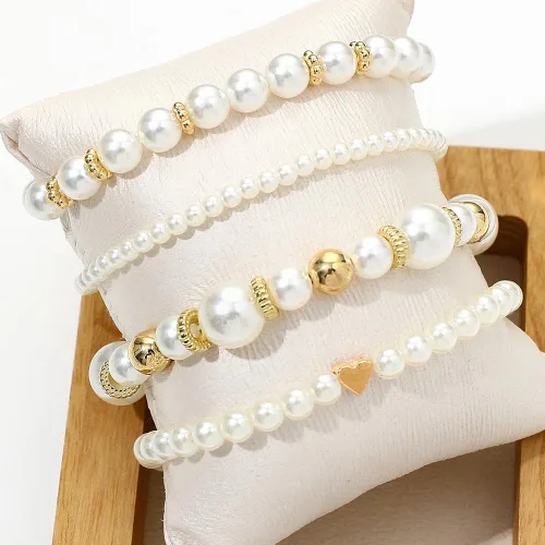 Vista 4 de Pulseras de perlas para mujer, pulsera de perlas de imitación con cuentas de perlas blancas, juego de pulseras elásticas apilables, pulseras