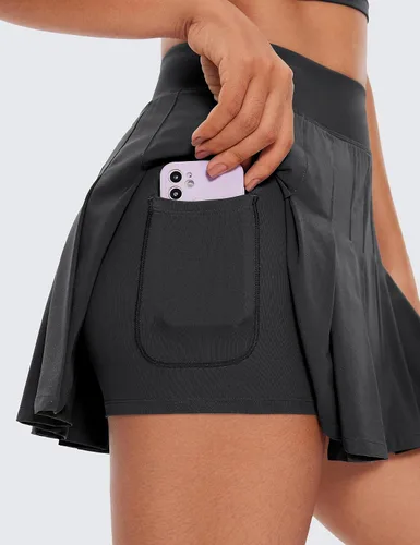 Vista 4 de CRZ YOGA Faldas de tenis plisadas de cintura alta para mujer, línea A, para entrenamiento atlético, golf, con bolsillos, estilo casual, patinadora