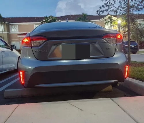 Vista 8 de iJDMTOY Luces reflectoras de parachoques LED de lente roja compatibles con Toyota Corolla Sedán 2019-22, funciona como faros antiniebla traseros